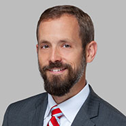 Standing photo of Energy and Telecommunications attorney Todd Griset