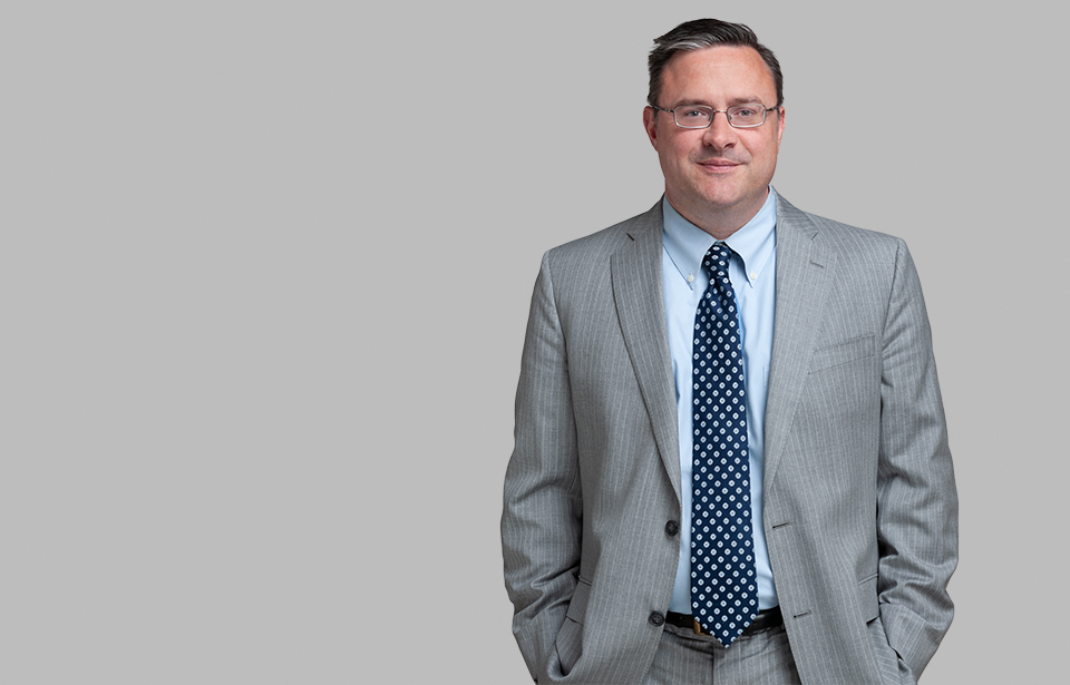 Standing photo of Creditors’ Rights and Bankruptcy attorney Tony Manhart