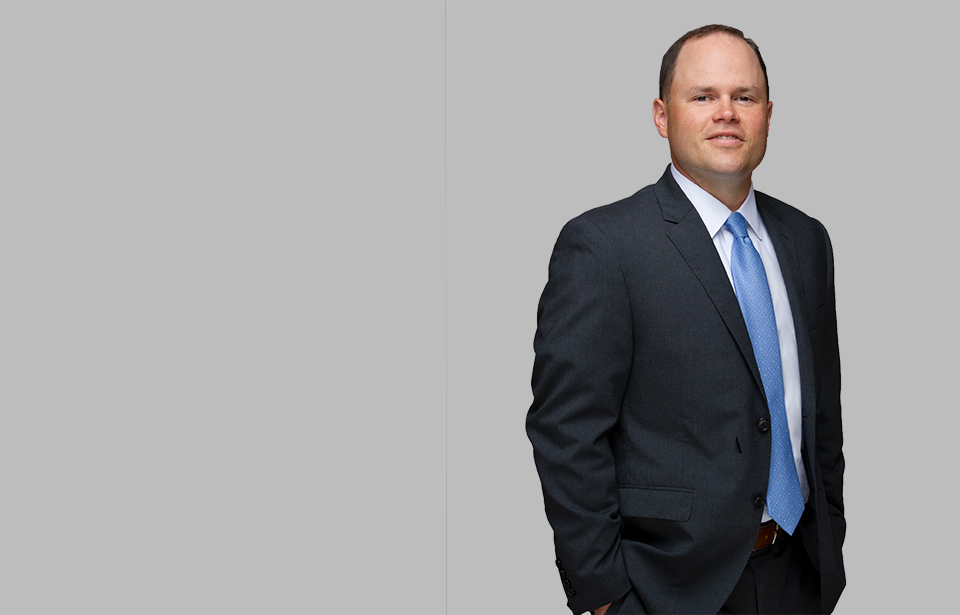 Standing photo of Litigation attorney Mike Smith